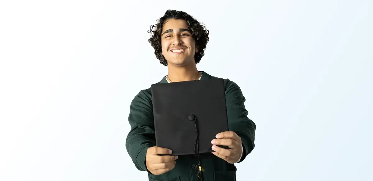 Student holding his graduation hat
