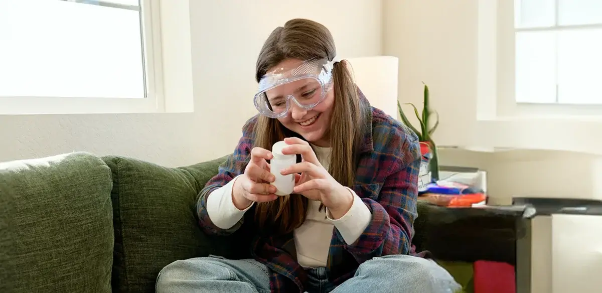Student wearing a pair of goggles
